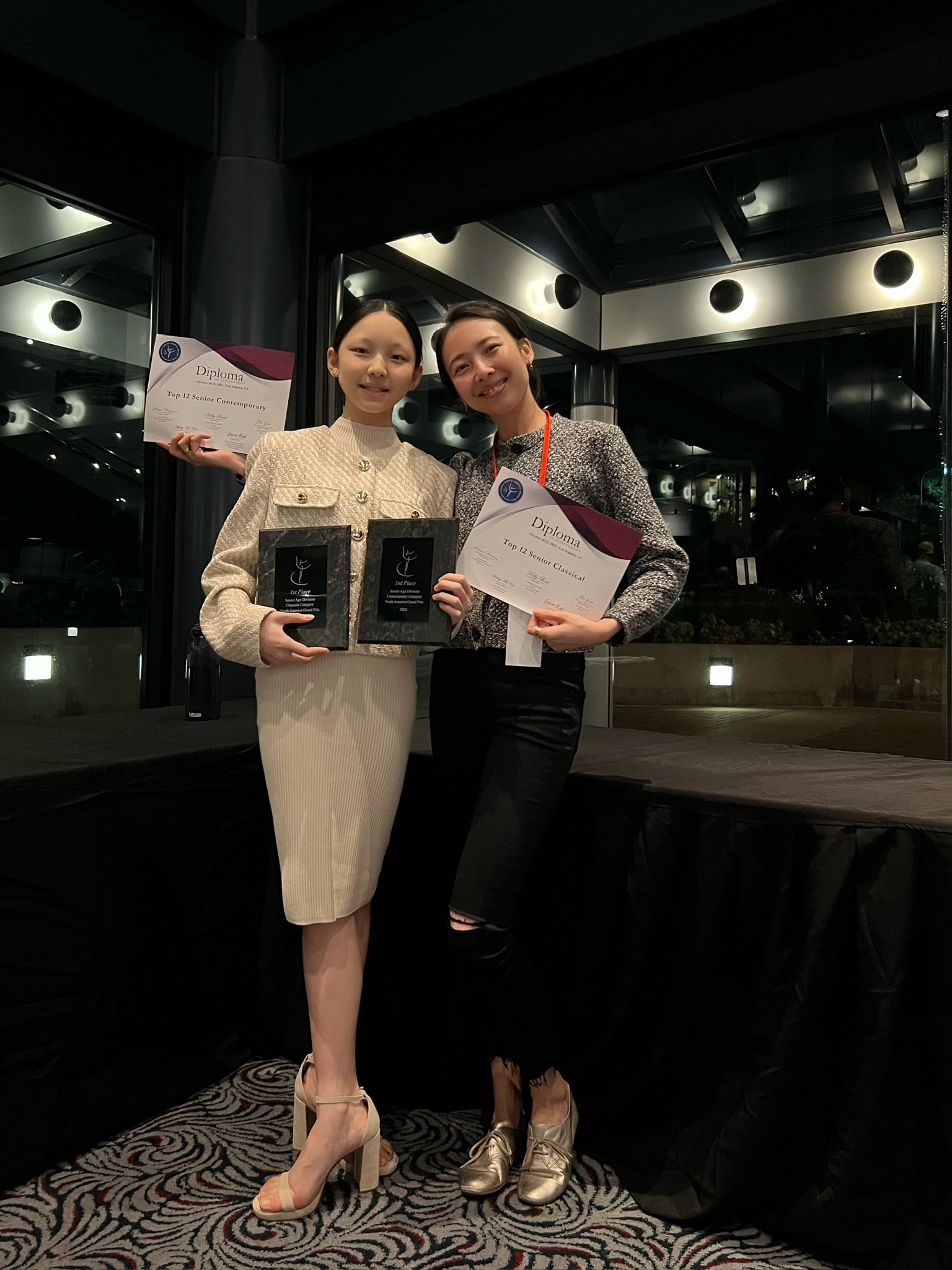 Mi Deng with student holding YAGP awards and diplomas
